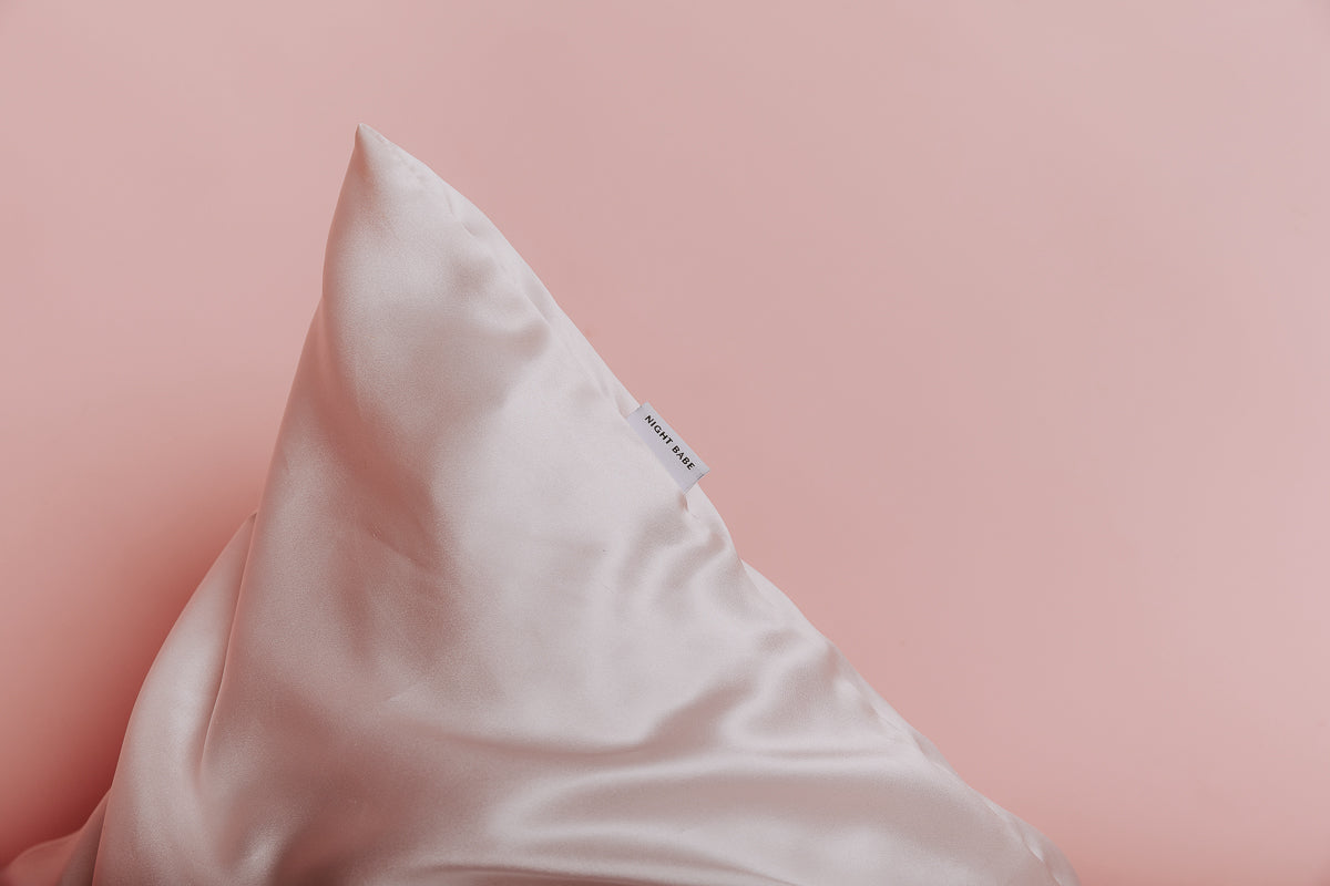 close up view blush pink silk pillowcase