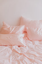 Load image into Gallery viewer, bed with blush pink silk pillowcases
