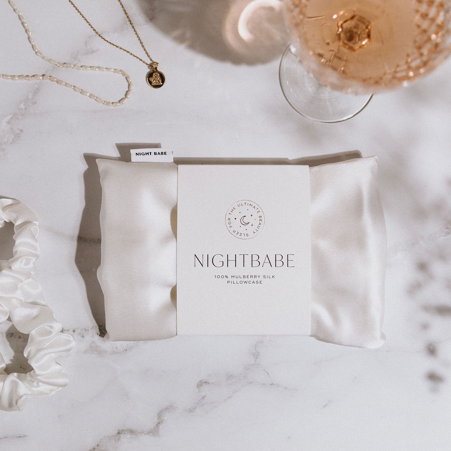 night babe ivory silk pillowcase styled in packaging